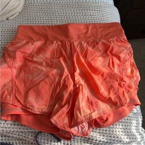 fabletics bright orange shorts